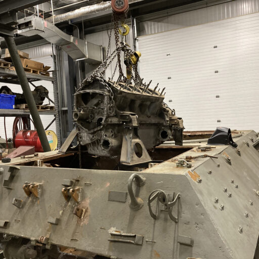 The test core Ford GAA engine for the reconstruction of the engine compartment goes in for a test fit.