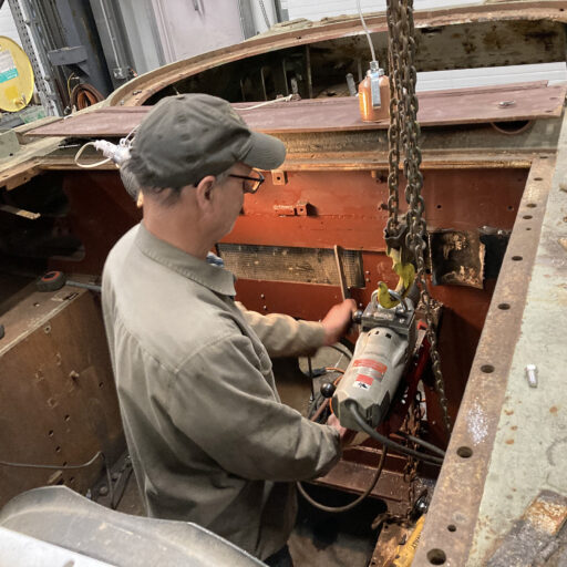 Volunteer Jim Winroth works on the newly fabricated firewall of the M36 Jackson to accommodate the original GAA V-8 engine.