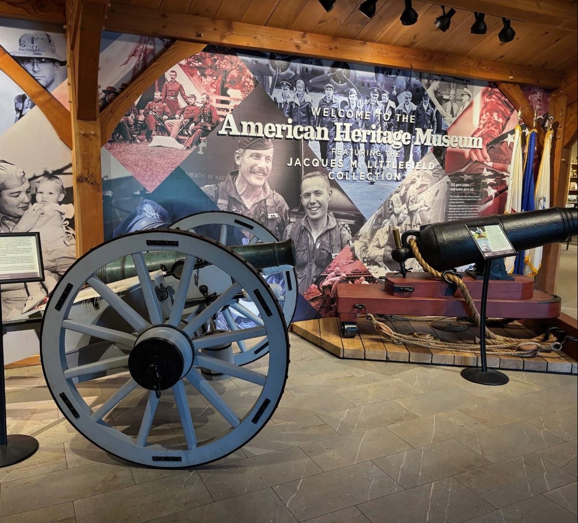 Museum interior with cannons and Welcome to the American Heritage Museum mural